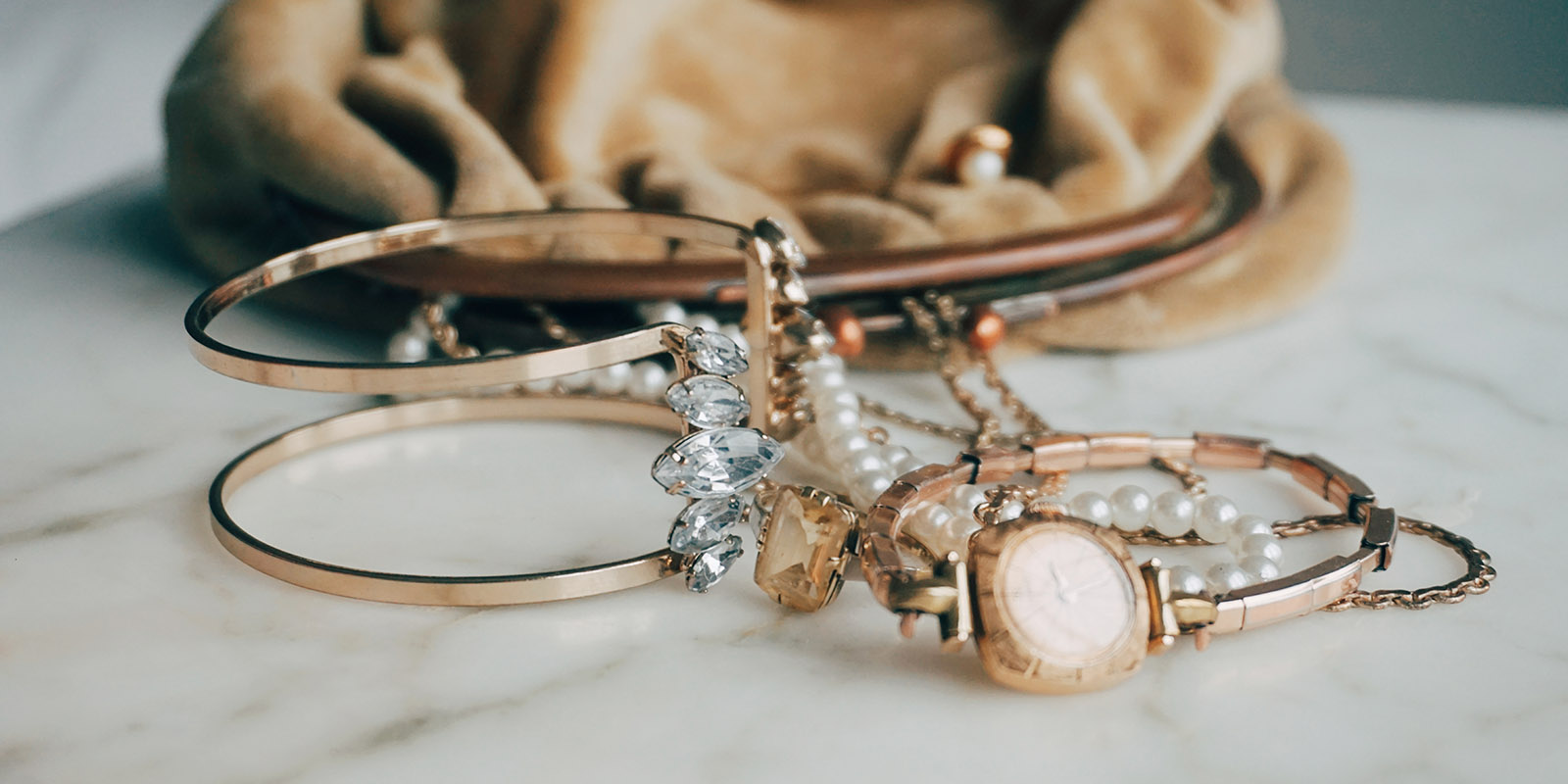 Directly Above Shot Of Jewelry By Purse On Table