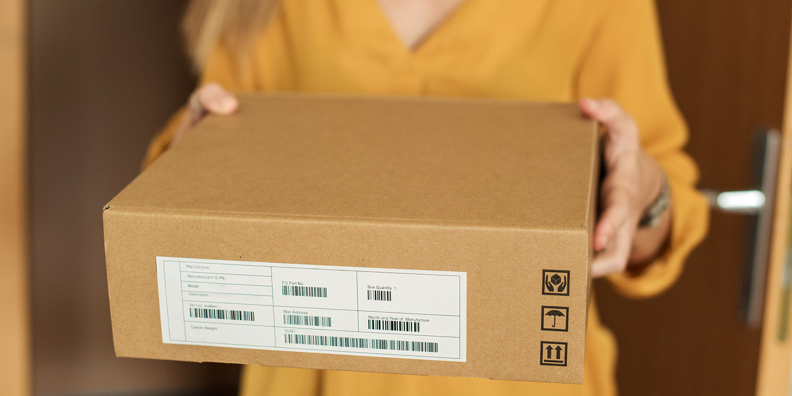 Close up of young woman receiving a package